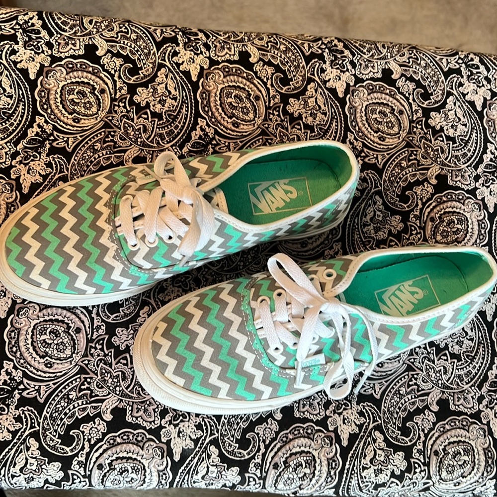 Teal, grey and white Vans.
